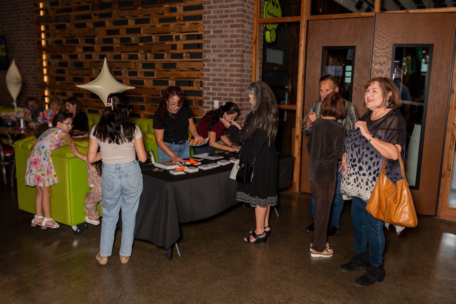 Guests checking in at the welcome table