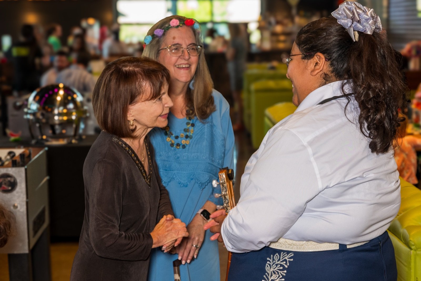 A mariachi musician greeting guests