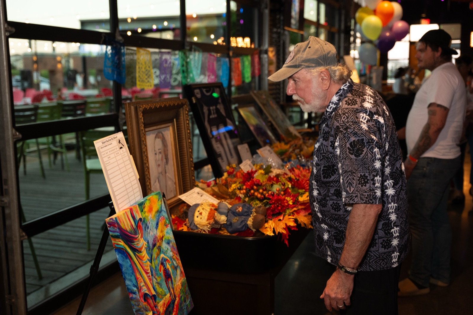 A guest browsing the silent auction items